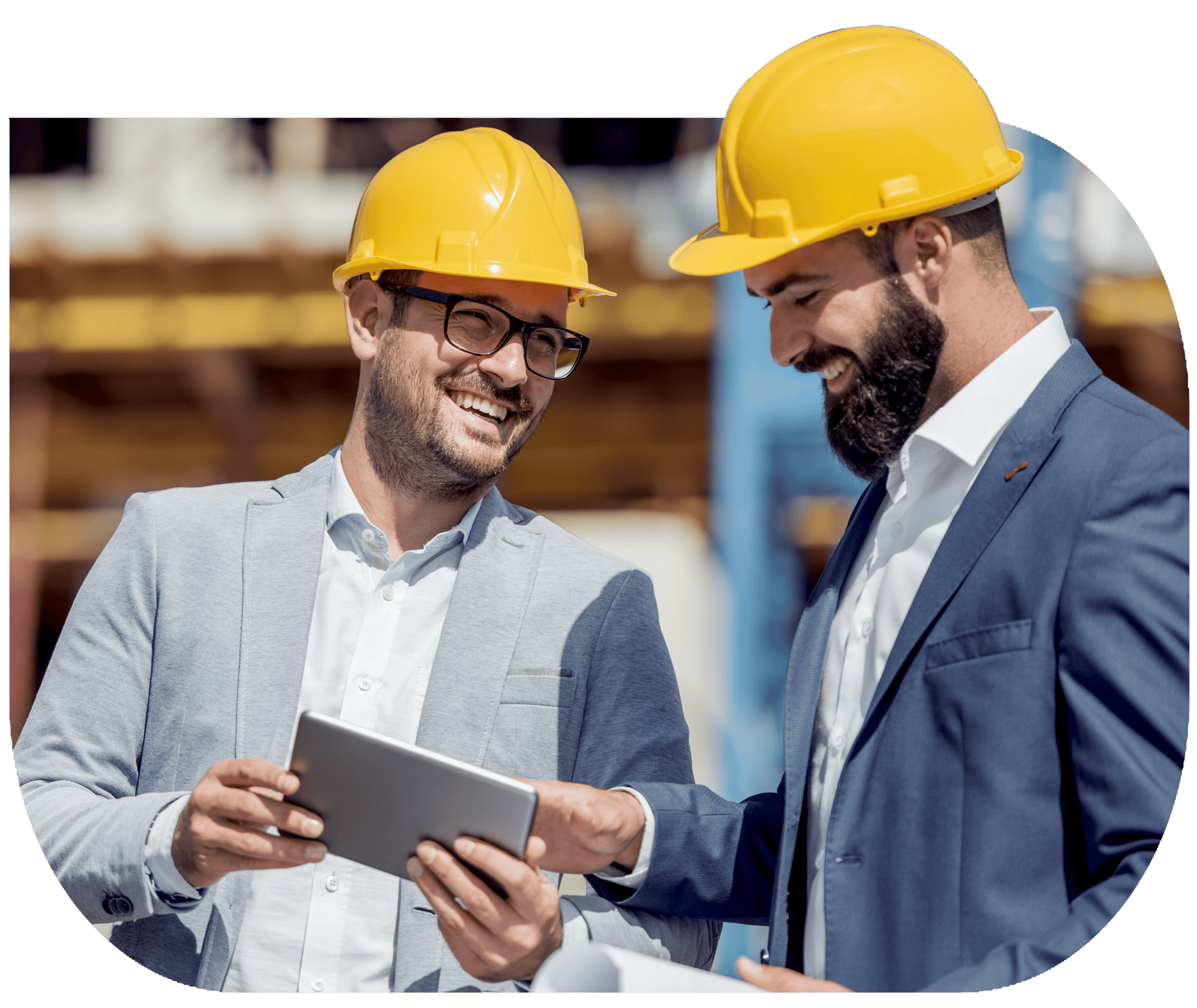 An image of two general contractors looking at a tablet