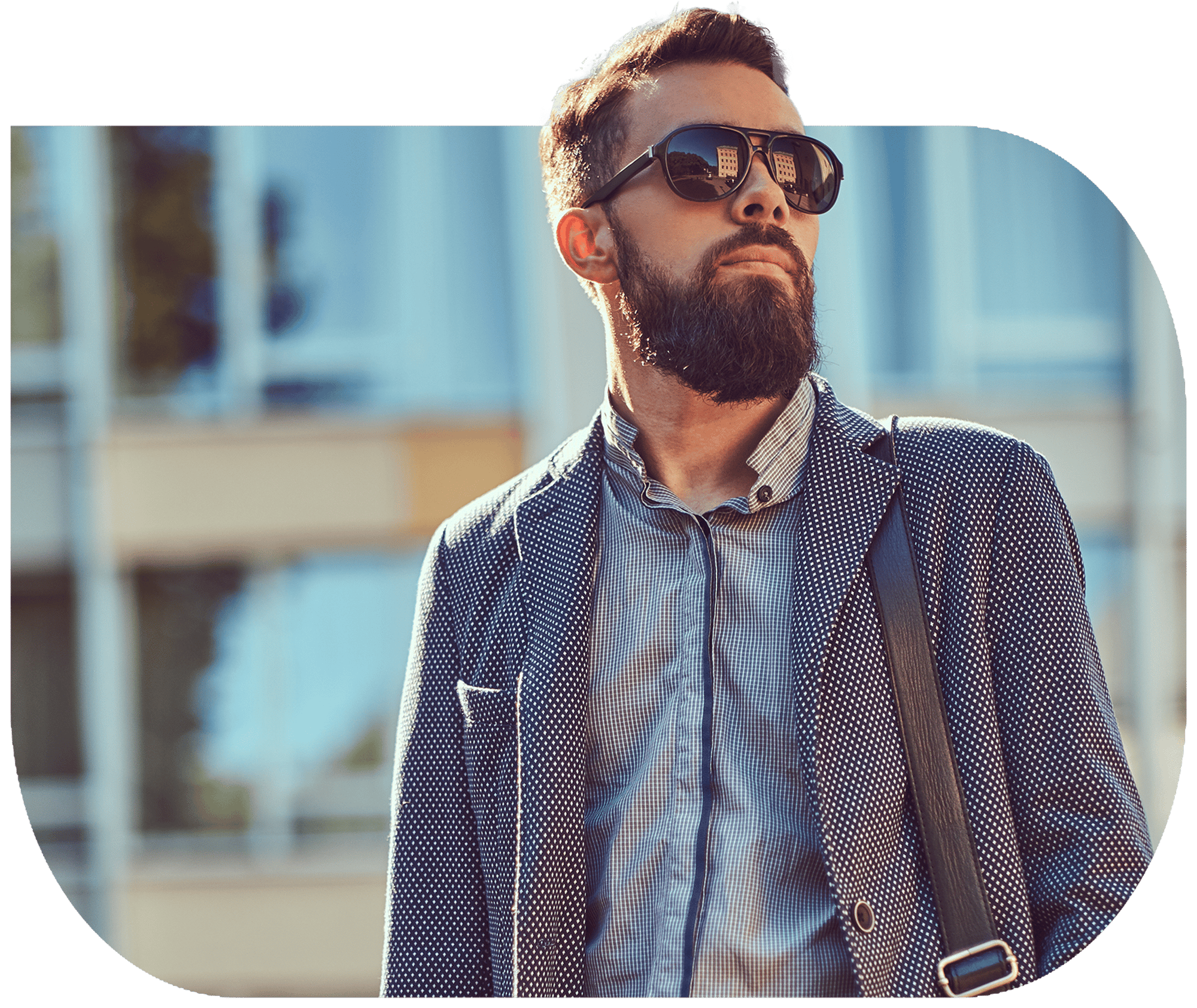 An image of a risk manager wearing sunglasses outside of an office building.