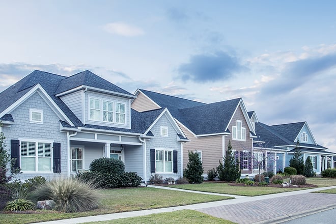 A street view of a new construction neighborhood.
