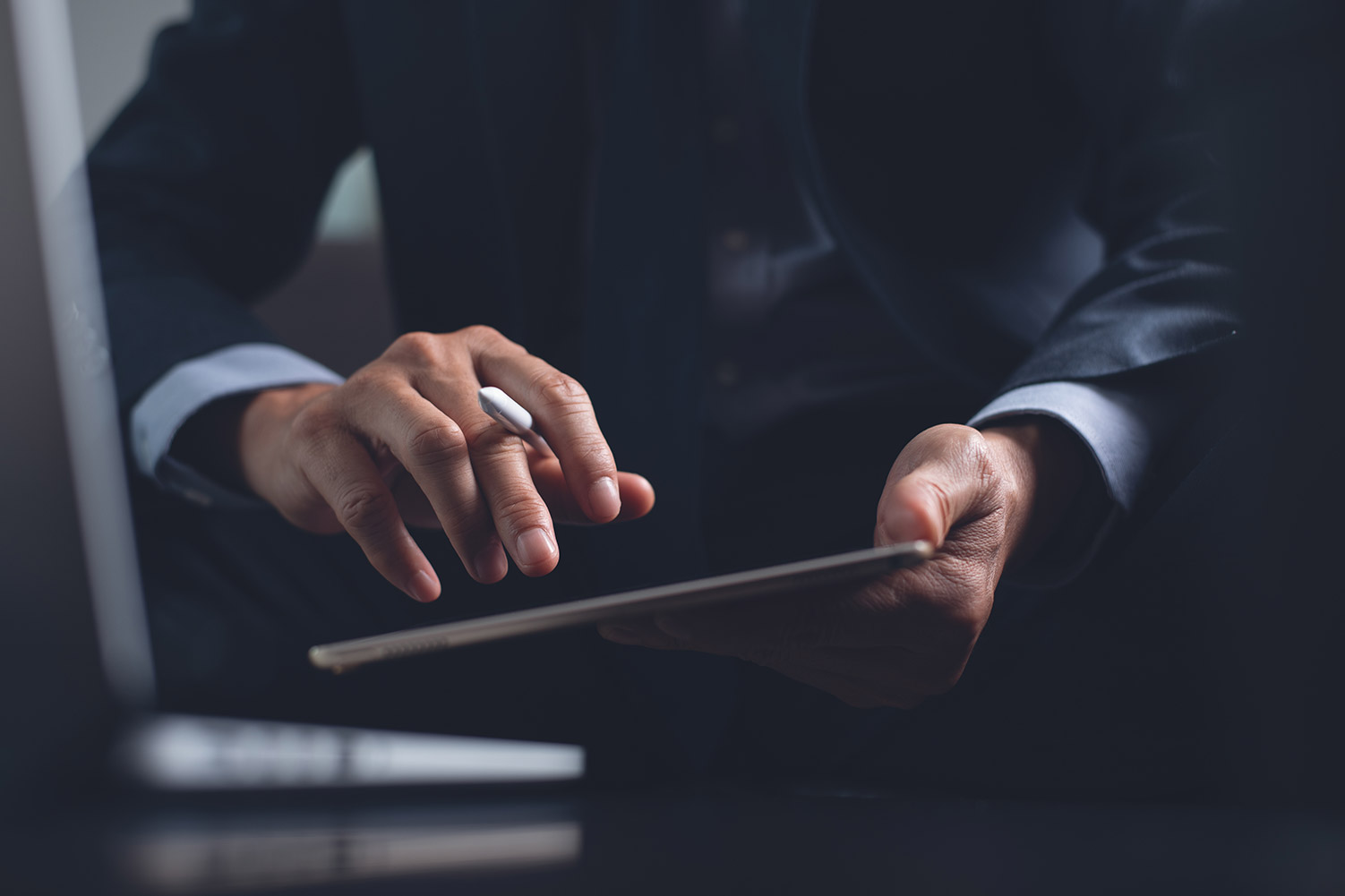 man working in office on tablet