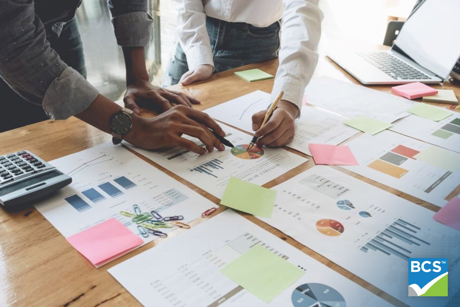 business people looking at documents on table