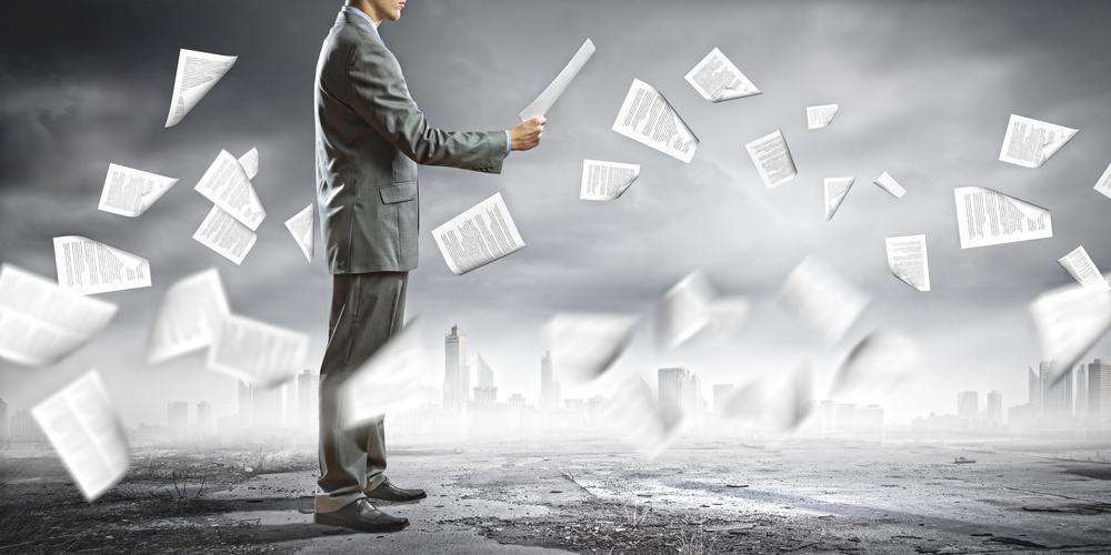 Businessman examining document in hands